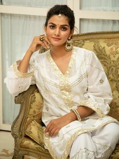 Noor Swetambari White Gota Work Kurta Set (Set of 2) By Maison Shefali now available at Trendroots Elegant Kurta For Puja And Navratri, Cream Palazzo Set With Straight Kurta For Festivals, Off-white Straight Kurta Palazzo Set For Festivals, Diwali Cream Palazzo Set With Straight Kurta, Off White Kurta With Gota Work For Eid, Elegant Resham Embroidered Kurta For Puja, Festive Off-white Straight Kurta Palazzo Set, Off White Kurta With Mirror Work For Festivals, Elegant White Kurta With Gota Work