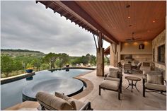 an outdoor living area with a pool and patio furniture