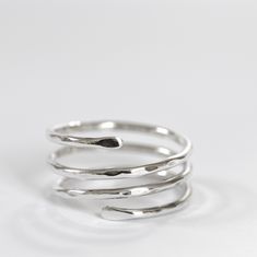 Sterling silver ring in the shape of a triple spiral, adjustable.  A very comfortable and versatile design.  The silver band can also be worn as a thumb ring for both men and women. It can be a great gift idea for a birthday or anniversary. Please, before buying, check your size carefully with a ring similar to this one. To be sure, measure the inside diameter of a similar ring and compare it with the diagram in the picture above. If you can, send me the internal diameter of your ring. If you ha Adjustable Silver Midi Rings With Modern Twist, Adjustable Spiral Silver Midi Rings, Adjustable Spiral Midi Rings In Silver, Adjustable Silver Spiral Midi Rings, Adjustable Sterling Silver Midi Rings With A Modern Twist, Modern Twist Adjustable Sterling Silver Midi Rings, Adjustable Spiral Stackable Rings, Adjustable Spiral Ring With A Modern Twist, Adjustable Spiral Rings With A Modern Twist