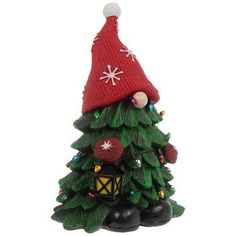 a small christmas tree with a red hat on top