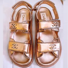 Brand New Authentic Chanel Gold Dad Sandals. Size 36. (They Run Large And Will Fit Size 6.5 To Size 7 Women’s Size.) Never Worn. Brand New In Box Plus Receipt. Selling Below Retail And Below What I Paid! Sold Out Everywhere!!!!!! Most Wanted Sandal!!!!! Luxury Gold Sandals With Round Toe, Luxury Gold Closed Toe Sandals, Designer Gold Sandals With Round Toe, Designer Gold Closed Toe Sandals, Designer Gold Flat Sandals, Luxury Round Toe Sandals For Summer, Chanel Thong Sandals, Silver Sandals Heels, Brown Strappy Sandals