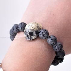 Realistic Human Skull is made os a kind of resin. We painted it after casting step to make a realistic looking. We sculpted a skull model to make a mold. All molds are made by Umay Designs.  10 mm Black Volcanic Lava Beaded Bracelet looks so cool with Human Skull charm. Thank you  Zeliha Umay  @umaydesigns Realistic Skull, Skull Model, Bracelet Art, Lava Bead Bracelet, Skull Gifts, Wearable Art Jewelry, Lava Beads, Black Skull, Art Resin