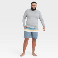 Stay comfortable on or in the water with the Regular Fit Long-Sleeve Rash Guard Swim Shirt from Goodfellow & Co™. This men’s rash guard features a regular fit with a solid hue for a no-nonsense look that’s perfect for hot days on the water. It’s made from soft fabric with added spandex for improved mobility and comfort, while UPF 50+ sun-blocking protection helps keep your skin safe from harmful sun rays. Whether you’re wading through the water or relaxing on the boat, this solid-color rash guar Mens Rash Guard Shirts, Stretch Rash Guard With Upf 50+ And Crew Neck, Long Sleeve Moisture-wicking Rash Guard For Beach, Stretch Upf 50+ Rash Guard For Surfing, Long Sleeve Moisture-wicking Rash Guard For Surfing, Michelin Man, Men Bodies, Swim Shirt, Pool Sizes