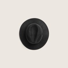 Hand made from soft 100% Australian wool, William Black is one of our most approachable and versatile wide brim styles. With a 6.5cm under welted rolled edge that can be worn up or down and finished with our signature embossed leather band accessory. It's the style that started it all and one of our favourite styles for both men and women. This hat is packable and ideal for travelling on your next adventure. Classic Black Fedora With Flat Crown, Black Wool Fedora With Flat Crown, Black Fur Felt Hat With Flat Crown, Classic Black Fur Felt Hat, Black Wool Felt Hat With Flat Crown, Black Wool Fedora With Curved Brim, Black Brimmed Fedora For Everyday, Black Leather Felt Hat With Curved Brim, Black Leather Felt Hat With Short Brim