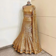 Gold lehenga with ready to wear embroidered blouse for women.  * Plus size available. * Couple dress available , matching men's kurta pajama with half jacket is included if ordered couple dress. *Kids dress available up to age 7 years. For above 7 years kids please order regular size. * Size: This is custom made outfit as per your size. Post your order we will send you a measurements reference sheet using which you can provide details required to make your outfit with best fit. * Fabric and work: Lehenga - Sequins Net fabric. Blouse - Sequins Net fabric. Dupatta - No separate dupatta. * Delivery time: This lehenga set will take 2-3 weeks to produce after we have received your sizing details. Don't worry it can be made sooner too, just keep us informed, we will process it accordingly and de Traditional Drape Fitted Dresses With Pallu, Fitted Dresses With Traditional Drape And Pallu, Fitted Gown With Resham Embroidery For Reception, Designer Fitted Anarkali Set With Sheer Dupatta, Fitted Gown With Resham Embroidery For Diwali, Designer Anarkali Set With Sheer Dupatta, Fitted, Fitted Dola Silk Saree With Sequins, Fitted Sequined Dola Silk Saree, Gold Fitted Sharara For Designer Wear