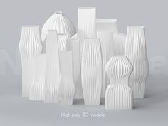 a group of white vases sitting next to each other