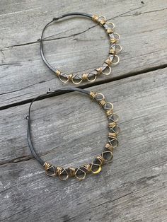 "** Due to excessively long delivery times and issues with Customs I no longer ship to Germany. I am sorry for any inconvenience. These large 2.5\" diameter hoops are made out of solid hypoallergenic black niobium that has been carefully wrapped in 14k gold fill wire. Lightweight despite their size, they are finished with black niobium earwires." Adjustable Black Hoop Earrings With Ear Wire, Adjustable Bohemian Hoop Earrings With Black Beads, Adjustable Black Beaded Hoop Jewelry, Unique Handmade Black Hoop Earrings, Bohemian Black Metal Hoop Earrings, Black Hoop Earrings, Black Hoops Earrings, Brass Hoop Earrings, Big Hoop Earrings