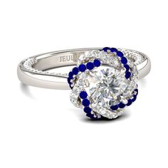 a diamond and blue beaded ring with the word'i love you'written on it