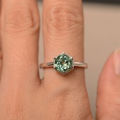 This is a gorgeous handmade creation. Its beauty is its simplicity & Elegance. The 7*7mm round cut lab green sapphireis crafted in solid sterling silver and with rhodium plated. All item is sent in a beautiful gift box You can realize more lovely stuff clicking the link https://www.etsy.com/shop/knightjewelry?refshopsection_shophome_leftnav Please leave the correct address and you phone number for delivering successfully. Green Solitaire Jewelry For Proposal, Emerald Ring With Accent Stones For May Birthstone, Green Sapphire Ring With Center Stone As A Gift, Solitaire Emerald Ring For May Birthstone, Tourmaline Round Cut Jewelry With Prong Setting, Green Round Cut Birthstone Ring With Accent Stones, Green Birthstone Ring With Accent Stones, Round Cut, Green Round Cut May Birthstone Ring, Green Birthstone Ring For May With Round Cut