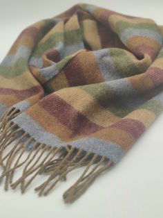 Irish Soft Lambswool scarf - 100% Pure New Wool - blue/bronze/burgundy/beige/green stripes - very soft - unisex - HANDMADE IN IRELAND Keep warm in style this season with our supersoft lambswool scarf. Woven in Ireland in traditional country checks with fringed trim. Lambswool is the highest quality sheep's wool. Along with being a naturally insulating, breathable and hypoallergenic textile, it's beautifully soft. Not to be confused with sheep's wool, lambswool is the wool from the first shearing Baby Sheep, Fashion Aesthetics, Craft Business, Sheep Wool, Mens Street Style, Green Stripes, The Library, Keep Warm, Scarf Wrap