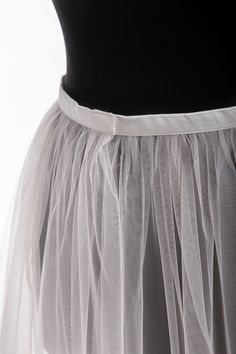 "Tulle overskirt Detachable skirt Tulle Overlay skirt Bridal train Removable tulle skirt Detachable bridal skirt Bridal overskirt This airy tulle overskirt is gorgeous for bride dress Color#1 in our color chart - white color. The skirt is fixed on the waist with a hook-and-loop fastener which is very convenient if you want to remove it. MATERIALS: Tulle: Luxury wedding tulle \"Hayal Tulle\" .Draped, flexible, and very soft and high-quality tulle. Durable and easy to handle. He a thinner and has Lined Tulle Maxi Skirt For Evening, Evening Tulle Maxi Skirt With Lining, Elegant Flared Tulle Skirt, Evening Tulle Skirt Bottoms, Evening Tulle Long Skirt, Evening Long Tulle Skirt, Elegant Crinoline Ruffled Skirt, Tulle Pleated Skirt For Evening, Elegant Pleated Full Tulle Skirt