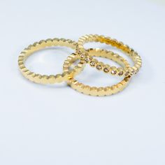 elevate your ring stack with our Sunset Lover Ring Stack. this premium set creates endless possibilities to elevate your jewelry capsule collection. wear each band individually or stack them together for a touch of luxury. the perfect addition for a sophisticated and minimal look. 18K gold pvd over 316L stainless steel water & tarnish resistant each band is 2mm thick set of 3 bands 1 cz bezel band, 2 solid bands Elegant Stacked Gold Rings, Elegant Gold Stacked Rings, Gold Plated Stackable Rings, Classic Gold Stackable Crystal Ring, Gold Crystal Ring With Round Band For Everyday, Gold Stacked Minimalist Midi Rings, Gold Stacked Midi Rings Minimalist Style, Minimalist Stacked Gold Midi Rings, Anniversary Gold-plated Stackable Rings