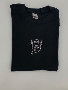 Halloween Tee! See You In Hell Ghost T-shirt embroidered on a 100% cotton tee in three color choices-sand beige, mocha brown or black. Made with love ❤️ Ships in 1-2 days with tracking ✉️ Custom Embroidered Cotton T-shirt For Streetwear, Black T-shirt With Custom Embroidery For Streetwear, Black Custom Embroidery T-shirt For Streetwear, Embroidered Crew Neck T-shirt For Streetwear, Halloween Embroidered Streetwear Top, Halloween Streetwear Embroidered Top, Black Cotton T-shirt With Custom Embroidery, Cotton T-shirt With Custom Embroidery For Streetwear, Custom Embroidery T-shirt With Relaxed Fit For Streetwear