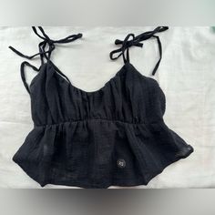 Black Cropped Tank Top From The Pacsun La Hearts Collection In Size Xs / Never Worn (The Straps Are Fraying Slightly) Black Crop Top Tank Top For Beach, Black Sleeveless Summer Top, Casual Black Cami Top, Cropped Tops With Tie Straps For Vacation, Black Sleeveless Tops For Vacation, Cotton Crop Top With Tie Straps For Beach, Beach Tops With Tie Straps, Black Tops With Tie Straps For Beach, Black Cotton Top With Tie Straps