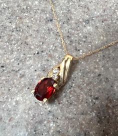 10K Yellow Gold Garnet & CZ Pendant Necklace  Weight:  1.2 grams  Gem Stone:  Garnet and CZ  Composition:  10K Gold, stamped on both pieces  Condition:  Good Era:  Vintage Measure:  3/16" (w) 5/8" (h)  Chain: 18" long Will ship in a gift box  Stock # N1159 As with all jewelers, I do enlarge pictures of the jewelry.  This is to your advantage, so you can see all details more clearly.  I do provide measurements of the jewelry, so be sure to read the description to better understand the true size o Cz Pendant, Gem Stone, Tape Measure, 10k Gold, Ruler, Garnet, Necklace Etsy, To Read, Jewelry Necklace Pendant