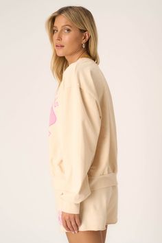 Meet you on the courts.The Pickleball Sweatshirt is inspired by the collegiate aesthetic we all can't get enough of. The playful pink graphic pops on our popular chalk colorway, creating the perfect combo of sporty and girly for spring. And, of course, you're guaranteed comfort with the baby French terry fabric. Pair with the Pickleball Short for the full outfit. 82% Cotton13% Polyester5% Spandex Care Instructions: Machine wash cold. Wash inside out with similar colors. Do not bleach. Lay flat t Athleisure Logo Print Sweatshirt For Spring, Logo Print Sweatshirt For Spring Loungewear, Spring Athleisure Sweatshirt With Logo Print, Athleisure Tops For College In Spring, Spring Athleisure Tops For College, Oversized Retro Sweatshirt, Cream Graphic Print Sweatshirt For Loungewear, Sporty Crew Sweatshirt For Spring, Sporty Crew Neck Sweatshirt For Spring