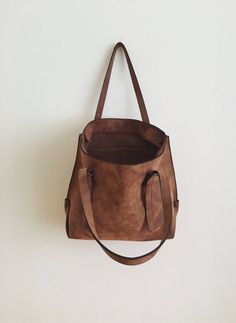 "This tote bag is made of high quality vegan leather in brown. It is soft and lightweight but durable. It stands on its own. It has a rustic, distressed look. It has one interior zipper pocket. Straps are adjustable. Measurements: 32 x 30 x 15 cm IMPORTANT! Your orders between 7-25 August will be shipped on August 28. Delivery takes 2-5 days to the US, Canada, Australia and Europe; in 3-7 days to rest of the world after shipping. For other color options you can check \"Totes\" section: http://et Brown Bag With Large Capacity For On-the-go, Dark Tan Leather Bag For On-the-go, Leather Softback Shoulder Bag For On-the-go, Vintage Brown Satchel For Daily Use, Large Capacity Brown Satchel For On-the-go, Brown Large Capacity Satchel For On-the-go, Brown Rectangular Satchel For Everyday Use, Brown Softback Shoulder Bag For Everyday Use, Leather Softback Shoulder Bag For Everyday Use