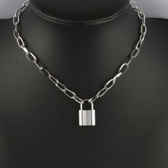 925 Silver Plated Padlock Necklace: Stainless Steel Chain with Lock Charm - A Stunning Jewelry Gift for Women Introducing a stunning addition to your jewelry collection that is sure to make a statement on any special occasion. This exquisite piece has been meticulously crafted with precision and care, making it a true embodiment of modern elegance and sophistication. From birthdays and weddings to anniversaries and graduations, this piece is the perfect gift for any special event.Whether you're looking to surprise a loved one or treat yourself, this piece of jewelry is a must-have addition to any wardrobe. Its versatile design allows it to complement any outfit, making it the perfect accessory for any occasion. With the holiday season just around the corner, this luxurious piece is the per Lock Necklaces, Lock Jewelry Necklaces, Padlock Chain Necklace, Lock Chain, Necklace Lock, Silver Metal Necklace With Lock Detail, Silver Chain Necklace With Lock, Sterling Silver Chain Link Jewelry Gift, Chain Link Jewelry With Sterling Silver Clasp As Gift