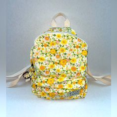 Cotton Canvas Fabric. Large Main Compartment. Front Zip Pockets. Adjustable Straps. 6.8 L Volume Capacity. Exterior Logo Label. 100% Cotton Nwot Volume And Capacity, Floral Backpack, Cotton Canvas Fabric, Logo Label, Bags Mini, Billabong, Yellow Orange, Orange Yellow, Color Orange