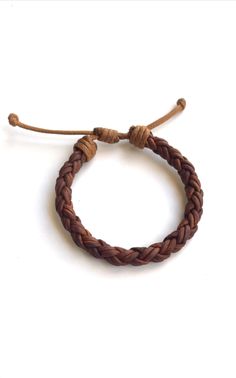 This lovely bracelet is made of authetic braided leather cord. It is adjustable. Please choose if the recipient is a Kid, a Woman, or a Man This bracelet is not Waterproof Interested in other colors, please send me a message. I can make a custom order for you Thanks for looking :) Luxury Brown Braided Bracelet As Gift, Leather Bracelet For Skateboarder, Casual Braided Bracelets With Adjustable Clasp For Friendship, Adjustable Brown Jewelry For Friendship, Adjustable Brown Leather Braided Bracelet, Brown Braided Leather Bracelet In Bohemian Style, Adjustable Braided Brown Jewelry, Casual Leather Bracelet With Adjustable Cord, Adjustable Leather Braided Bohemian Bracelets