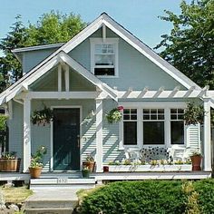 a house with white trim and blue siding