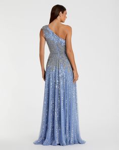 a woman in a blue evening gown with one shoulder and sequins on it