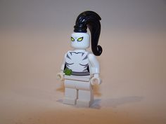 there is a lego figure with an evil look on it's face and black hair