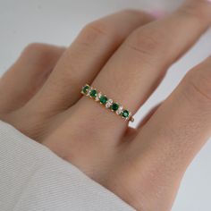 Beautifully crafted emerald ring is a true stunner! Looks great stacked or on its own! - - - D E T A I L S - - - * Made of 925 Sterling Silver * We use a THICK plating of 14k Gold or Rhodium * Available in sizes 4-10 * Nickel-free & Hypoallergenic - Will not turn your fingers green! * Made of the highest grade cubic zirconia for an authentic look! * Also available in Turquoise or Opal! If you're unsure of your ring size, we recommend trying our ring size tool! https://www.etsy.com/listing/124090 Emerald And Silver Ring, Green Silver Ring, Emerald Ring Stack, Emerald Ring Band, Green Wedding Ring, Green Wedding Band, Green Gold Ring, Gold Ring With Emerald, Emerald Ring Silver