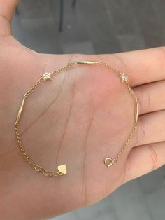 14K Solid Gold  Dainty Star Bracelet  * Gold KT: 14K Solid Gold * Gold Color: 14k Yellow gold Follow on Instagram - @bayargold.tr My Web Site - https://www.bayargold.com/ * Bayar Gold is a fine jewelry company. Please do not hesitate to ask us questions. We are always here to help you. * All items are packed in the high-quality jewelry box. The gift message is available. Please let us know what to write by leaving us a note at checkout. * Gift wrapping available.  Express shipping * United States: 4-6 business days * Canada: 4-6 business days * Europe: 4-6 business days * Australia: 4-6 business days * UK: 4-6 business days * Worldwide: 2-7 business days Want to find out more? Check out my shop ▶ https://etsy.me/3yqthdk Go Directly My Sections ▶ Gold Bracelets -  https://etsy.me/3OOQIUI ▶ Dangling Bracelet, Sequin Bracelet, Gold Bracelet Bangle, Elegant Anklet, Gold Herringbone Chain, Initial Bracelet Gold, Gold Bracelet Simple, Gold Snake Chain, Solid Gold Bracelet