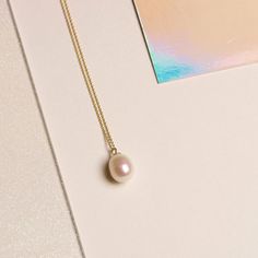 We’re picky about our pearls. Our collection of modern-feel pearl pieces takes your grandmother's favorites and incorporates them into the latest trends, interpreted from our NYC-gal perspective. These gem-quality pearls are freshwater cultured beauties, set in solid gold that won't tarnish or flake. We may have expensive taste, but crazy mark-ups aren’t really our thing. So we balance the best quality and the best price — enough said. 14k Solid yellow gold 9mm x 7mm Oval-shaped freshwater cultu Refined Pearl Chain Necklace As Gift, Refined Pearl Chain Necklace For Gift, White Minimalist Necklace For Everyday Elegance, Minimalist White Necklace For Everyday Elegance, Refined White Necklace With Pearl Charm, Refined Pearl White Necklace For Gift, Akoya Pearl Pendant Jewelry, Refined Akoya Pearl Necklace For Gift, Refined Pearl White Necklace With Pearl Pendant