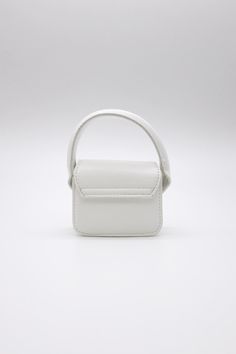 Bethany Micro Mini Bag This product has been hand-picked by Storets' stylists. Cream Bag With Adjustable Handle For Daily Use, White Bag With Adjustable Handle For Daily Use, Everyday Cream Handheld Bag, Everyday Handheld Cream Bag, Everyday Handheld Cream Bags, White Rectangular Bag With Top Carry Handle, Cream Rectangular Bag With Adjustable Handle, White Box Shoulder Bag With Handles, White Square Bucket Bag