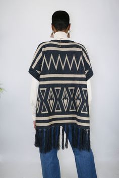 Slide on and go with this easy to wear poncho. She’s understated with neutral colors, but her woven details are what makes her the perfect statement of your look. The tassels are a fun touch and gives her some added length. One size fits most Made of Acrylic Oversized Fringe Casual Poncho, Oversized Fringe Poncho Casual Style, Casual Winter Poncho With Tassels, Casual One Size Poncho With Fringe, Casual One-size Poncho With Fringe, Oversized Fringe Cape Poncho, Beige Fringe Poncho For Fall, Fringe Poncho Cape For Fall, Fringed Cape Poncho For Fall