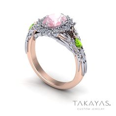 a pink and green ring with leaves on it's sides, surrounded by diamonds