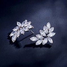 A delightfully unique pair of bridal earrings with an incredible sparkle! Adorned with flawlessly faceted cubic zirconia that capture the light in a dazzling array of sparkles, the earrings are rhodium plated for a bright finish which enhances the intricate detailing and conveys a modern take on old elegance. The earrings are 1" (approx. 2.5cm) in length and come with sturdy backs. Available in Silver, Rose Gold and Yellow Gold finishes. To make your choice select your preferred finish from the Glamorous Diamond White Cubic Zirconia Earrings, Dazzling Cubic Zirconia Bridal Earrings, Dazzling Diamond White Crystal Earrings, Glamorous Sparkling Cubic Zirconia Diamond Earrings, Diamond White Brilliant Cut Crystal Earrings, Elegant Diamond White Cubic Zirconia Crystal Earrings, Wedding Earrings With Brilliant Cut Cubic Zirconia, Sparkling Cubic Zirconia Bridal Earrings For Anniversary, Dazzling Earrings With Sparkling Cubic Zirconia