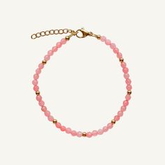 A wearable embrace of the rosy warmth of summer's embrace. This beaded stacking bracelet captures the essence of a sunlit dawn, exuding the delicate blush of blooming petals. Wear it alone for a subtle pop of color, or layer it with other pieces to craft your own personalized palette of shades. Its flexible design ensures comfort without compromise on style. Created with a stainless steel base and utilizing an extra luxurious 18 karat gold plating for the perfect, water & sweat proof finish. 18k Hand-strung Pink Bracelets For Everyday Wear, Adjustable Pink Pearl Bracelet Feminine Style, Pink Adjustable Feminine Pearl Bracelet, Beaded Bracelets For Everyday Spring Wear, Everyday Pink Hand-strung Bracelets, Everyday Beaded Bracelets For Spring, Adjustable Feminine Pink Pearl Bracelet, Elegant Adjustable Crystal Bracelet For Spring, Pink Jubilee Bracelet With Round Beads