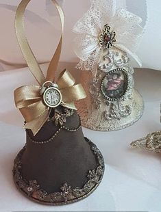 three small hats with gold ribbons and clocks on them are sitting next to each other