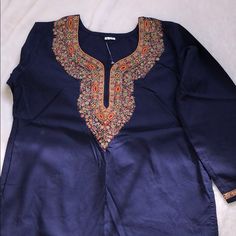 Brand New Never Worn Beautiful Navy Blue Blouse With Long Sleeves Hand Made Detailed Embroidery. Pictures Do Not Do It Justice. Size Large. Long Sleeve Blue Tops For Eid, Festive Blue Embroidered Top With Intricate Details, Festive Blue Embroidered Top With Intricate Embroidery, Festive Blue Top With Resham Embroidery, Blue Tops With Intricate Embroidery In Traditional Style, Festive Blue Kurta With Embroidered Neckline, Blue Traditional Tops With Intricate Embroidery, Festive Blue Tops With Intricate Embroidery, Blue Kurta With Embroidered Neckline For Festive Occasions