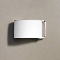 Our plain-finished sterling silver belt buckle is handcrafted in the United States. Made using 925/1000 silver, our sterling silver belt buckles are polished to a brilliant, shiny finish and plated with a layer of pure Rhodium for added durability and diminished tarnishing. This sterling silver plain belt buckle is suitable for engraving, and a range of personalized monogram styles or initial lettering fonts is available — there is no additional engraving charge. We offer two loop sizes, with th