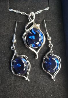 "Brilliant Deep Blue Sapphire Necklace And Earrings, 10x12mm And 8x10mm Simulated Lab Created Gems, 925 Sterling Silver Pendant, Rhodium Plated,  Cubic Zirconia Pave' Trim,18\" Sterling Chain. Chain Length Options Available By Messaging Seller At Time Of Purchase. Matching 925 Sterling Earrings, Rhodium Plated, Ear Wire Style. Gift Box Included." Silver Sapphire Dangle Jewelry, Formal Sapphire Sterling Silver Jewelry Sets, Teardrop Sapphire Sterling Silver Jewelry, Sapphire Jewelry Sets With Matching Earrings As Gift, Silver Sapphire Jewelry For Jewelry Making, Fine Jewelry Sets In Sapphire Sterling Silver, Sapphire Sterling Silver Fine Jewelry Sets, Sapphire Sterling Silver Jewelry Sets, Sapphire Sterling Silver Jewelry Sets For Anniversary