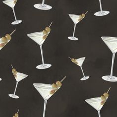 several martinis with olives on a black background, painted in acrylic