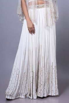 White padded blouse featuring floral hand embroidery all over. Paired with an embroidered palazzo and a sheer cape. - Aza Fashions Blouse Halter Neck, Sheer Cape, Floral Hand Embroidery, Cape For Women, Diana Penty, Padded Blouse, White Kurta, Palazzo Set, Luxury Sale