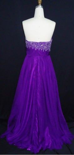 Darius Cordell Fashion Ltd has empire waist formal dresses in purple like this one.  Search for more strapless style options in our catalog. Purple Sleeveless Evening Dress For Debutante Ball, Purple Gown With Fitted Bodice For Prom, Purple Strapless Dress For Prom Season, Purple Strapless Dress For Prom, Purple Gown With Pleated Fitted Bodice, Purple Gown With Pleated Bodice, Elegant Purple Strapless Dress For Wedding, Purple Gown With Fitted Bodice And Sweetheart Neckline, Purple Dress With Fitted Bodice For Debutante Ball