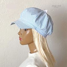 This fashionable cap for women is made of cotton fabric. A beautiful cap with a bow is a very fashionable item for your summer wardrobe. The visor of the cap is asymmetric, - an unusual shape. Beautiful pale blue color goes well with white. This cap is suitable for various occasions - walking along the city streets on a hot sunny day, a beach holiday, etc. Cap with cotton lining. Size 55-57 cm. Blue Brimmed Baseball Cap For Beach, Fun Blue Visor Baseball Cap, Blue 5-panel Summer Hats, Blue Cotton Visor Hat, Adjustable Blue Baseball Cap With Upf 50+, Pale Blue Color, Bow Fashion, Summer Cap, Fashion Cap