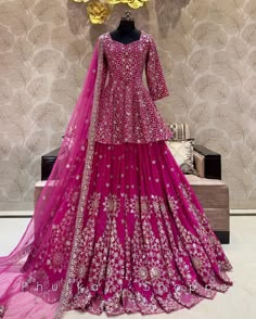 Made to Order/Measurement/Custom Order Lehenga - Color : Rani Pink - Fabric : Embroidered Georgette - Fully flared paneled lehenga - Embroidered  Blouse -  Net Dupatta with Gold Border - Drawstring closure with Tassels - - It can be customize in any design or size  PLEASE NOTE: BUYERS ARE RESPONSIBLE FOR ANY CUSTOMS AND IMPORT TAXES THAT MAY APPLY. This is a made to order product. If you opt for 'Made To Measurement Option', we will provide a measurement template and you can share the measurements likewise. If you want to opt for 'Standard Size', Please refer to the size chart provided in the listing. Shipping: Standard Shipping is done by DHL ecommerce and it mostly takes 2 to 3 weeks to deliver after dispatch. Express Shipping is done by DHL express and it mostly delivers within a week a Pink Palazzo Set For Diwali, Traditional Peplum Lehenga For Reception, Pink Palazzo Set With Dori Work For Wedding, Pink Designer Wear Unstitched Sharara, Traditional Peplum Lehenga With Dupatta, Pink Palazzo Set With Resham Embroidery For Reception, Pink Peplum Set For Eid, Designer Pink Sharara For Eid, Eid Peplum Sharara With Zari Work