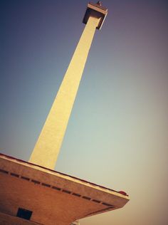 a tall tower with a clock on it's side