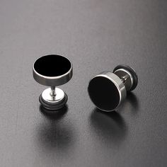 Unleash your inner style maverick with our Men's Stainless Steel Stud Earrings in sleek black. Crafted for the modern trendsetter, these earrings blend contemporary edge with timeless sophistication. Forged from high-quality stainless steel, these studs exude durability and resilience, ensuring they stand the test of time. The sleek black finish adds a touch of understated elegance, making them versatile enough to complement any ensemble, whether casual or formal. With a minimalist design, these earrings offer a subtle yet impactful accent to your look, effortlessly elevating your style game. Lightweight and comfortable to wear, they are perfect for everyday wear or special occasions, adding a dash of confidence and charisma to your persona      Earrings Height: 10mm Width: 10mm     Materi Modern Black Jewelry With Black Enamel, Minimalist Black Stainless Steel Earrings, Modern Internally Threaded Adjustable Earrings, Modern Black Stainless Steel Jewelry, Nickel-free Black Metal Plug Earrings, Sleek Black Everyday Jewelry, Modern Adjustable Black Jewelry, Modern Black Plug Earrings As Gift, Modern Stainless Steel Earrings