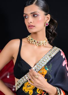 Featuring an elegant black printed saree with a beautiful hand embroidered border. Teamed gracefully with a beautiful black organza satin blouse, this set is your go-to for turning heads at wedding occasions. This saree is pre stitched saree for your convenience. Trend together with your partner with a matching Indo Western Kurta or Half Jacket Set Composition : Saree and Blouse - Organza Satin Care: Dry Clean Only and Vacuum Storage This product can be customized for sleeves, length of blouse a Black Printed Saree, Pre Draped Saree, Pre Stitched Saree, Blouse Organza, Sabyasachi Saree, Saree With Belt, Stitched Saree, Draped Saree, Half Jacket