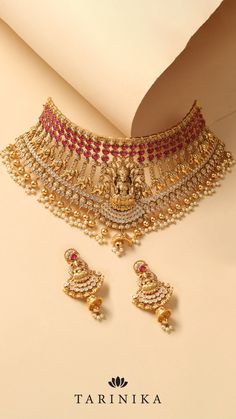 Embrace the timeless charm of the Maitreyi Antique Temple Choker Set and adorn yourself with its majestic presence. Shop now and experience the enchantment of this exceptional masterpiece. Festive Temple Jewelry Bridal Choker Necklace, Festive Temple Jewelry Bridal Choker, Wedding Temple Jewelry Choker Necklace, Heavy Temple Jewelry Bridal Choker Necklace, Heavy Temple Jewelry Style Bridal Choker, Heavy Temple Jewelry Style Bridal Choker Necklace, Bridal Choker Necklace With Intricate Design For Festive Occasions, Festive Bridal Choker Necklace With Intricate Design, Festive Bridal Choker With Intricate Design