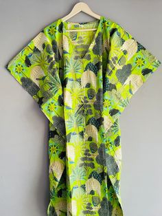 This Beautiful Indian Cotton Caftan Or Can Be Called As Tunic Is Made With Super Fine Quality Cotton And Designs Have Been Crafted By Hand Prints. Measurements :- Size - Free Size Length -138 Cm / 54 Inches Bust/Chest Size - 87 CM/ 34 Inches Fabric - 100% Cotton Pattern - Floral Kaftan Has Adjustable Drawstring Waist To Loose Or Tight , Kaftan Has V Shape Neck Which Is 8" Inches Deep. Kaftan Is Multi-Purpose And Can Be Worn As A Cover Up At The Beach ,Lounge Wear ,Sleepwear ,Pregnant Women Hospital Gown For Newly Moms ,Maxi Dress ,Free Dress Etc . Indian Kaftan Very Comfortable To Wear In Both Hot Or Cold Weather. Kaftan Is Super Comfortable .It Will Be Loose And Free Flowing And Fabric Is Very Soft With Vibrant Color Note :-Due To Different Monitor Setting Colors May Be Little Vary To Ori Green Printed V-neck Kaftan, Green V-neck Printed Kaftan, Traditional Green Floral Print Kaftan, Traditional Green Floral Kaftan, Tropical Green Kaftan For Beach Cover-up, Patterned Kaftan With Kimono Sleeves For Beach, Patterned Long Kaftan For Beach, Bohemian Green Kaftan With Kimono Sleeves, Long Patterned Kaftan For Beach