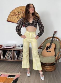 Pretty polyester gingham trousers from the 70s! Cute and summery country, hippie vibes. The color and gingham print of these make me happy In great condition, a little bit of a loose seam on the seat, not a big deal.  Measurements: Waist: 24" Hips: 35"-36" Inseam: 29" Length: 40" Model's measurements: 5'8" 34'' bust, 22'' waist, 35.5'' hips Spring Hippie Wide Leg Bottoms, Hippie Wide-leg Bottoms For Spring, High Waist Hippie Pants For Spring, Hippie Wide Leg Bottoms For Spring, Hippie Style Cotton Bottoms For Spring, Spring Hippie Fitted Pants, Hippie Bottoms For Summer Day Out, 70s Inspired High Waist Spring Pants, High Waist 70s Inspired Pants For Spring